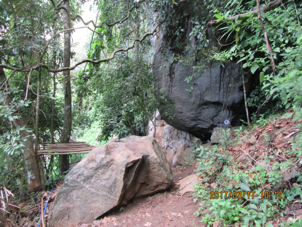 Entering the cave from the path.